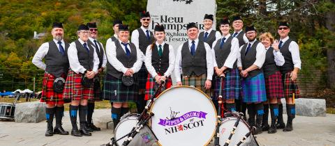 An image of the Pipes and Drums of NHSCOT band. 
