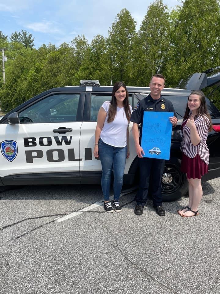 An image of three town of Bow employees in front of a Bow PD cruiser. 